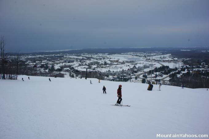 View of ski slope, Georgian Bay and village below